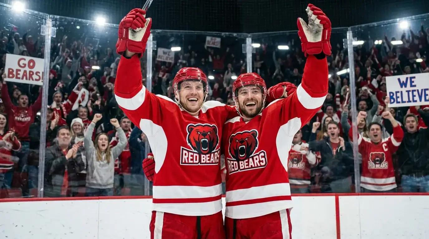 NHL player celebrating a goal with teammates on the ice