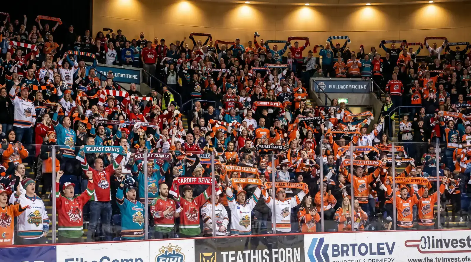 Sold-out EIHL arena in Nottingham with thousands of fans waving scarves during a Panthers game
