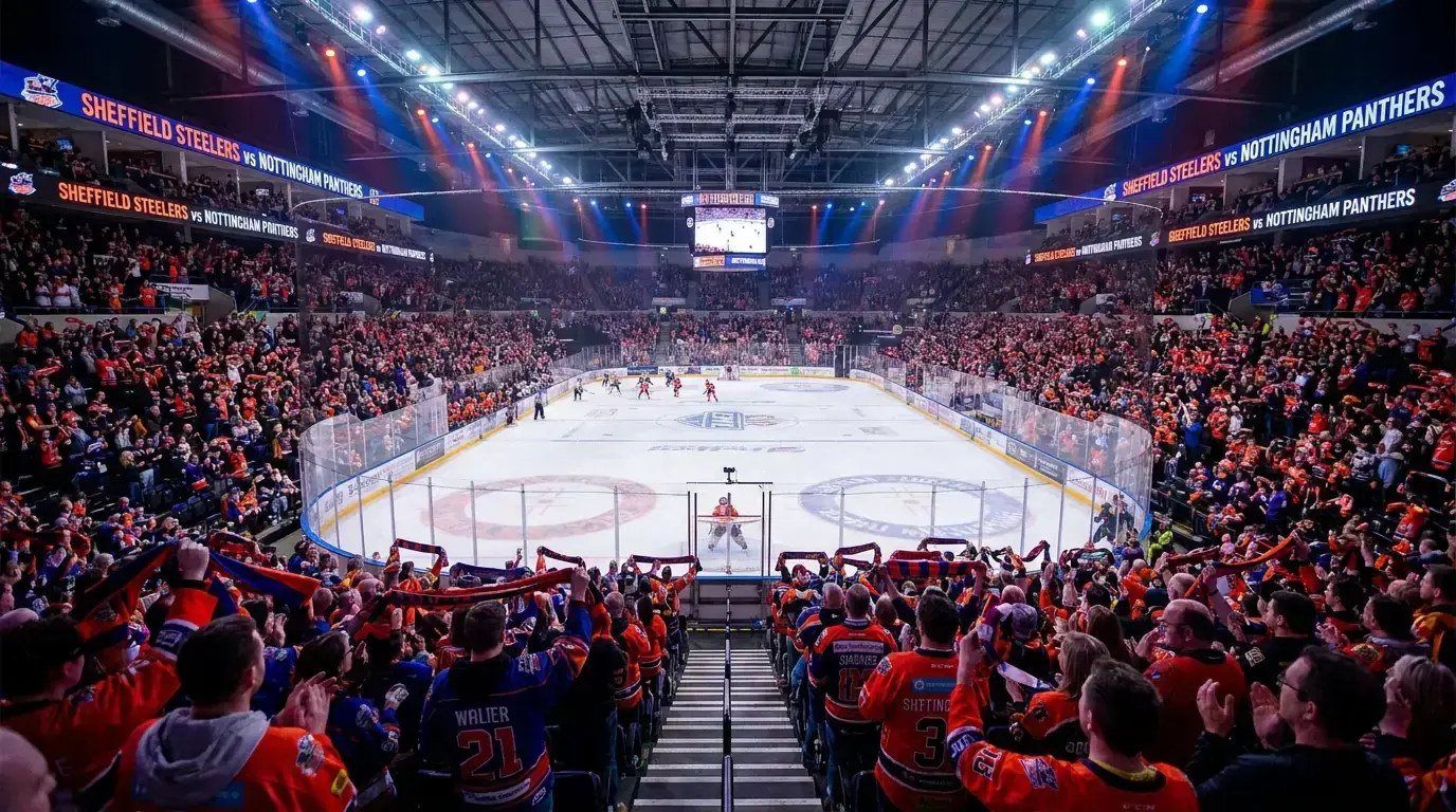 Packed EIHL arena in the UK with fans cheering during a British ice hockey match