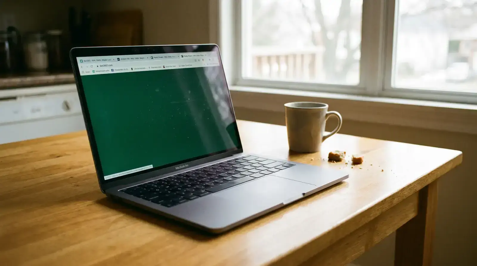 Multiple browser tabs open on a laptop comparing NHL betting odds across UK bookmaker websites